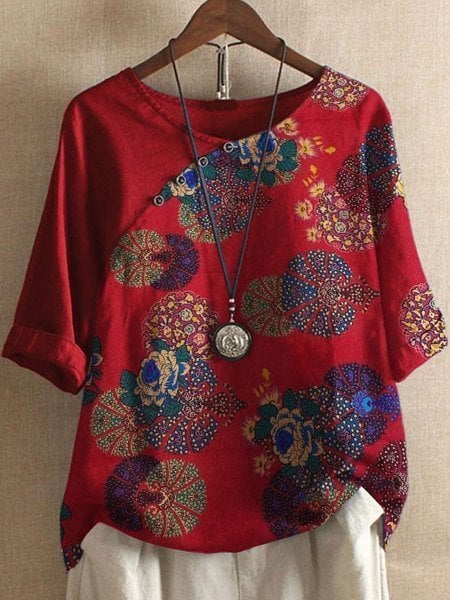 Loose-fitting blouse with floral sleeve