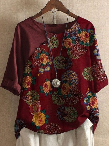 Loose-fitting blouse with floral sleeve